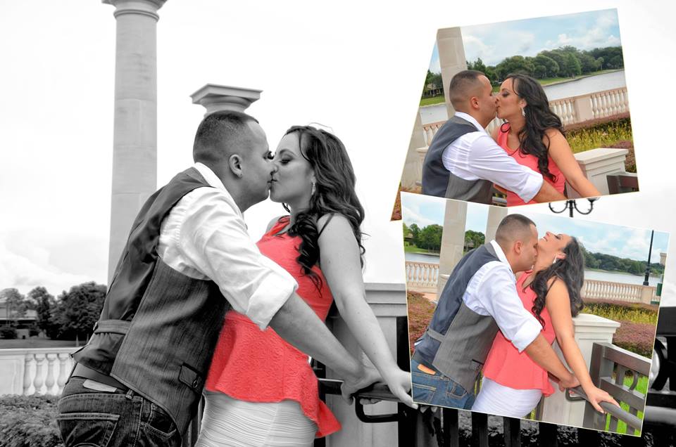 A couple sharing a kiss in a romantic setting by the water.