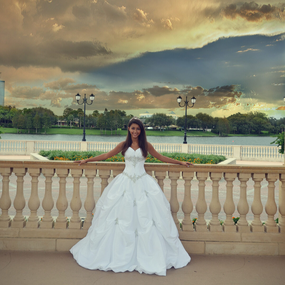 Bride posing outdoors in a white wedding gown during sunset.