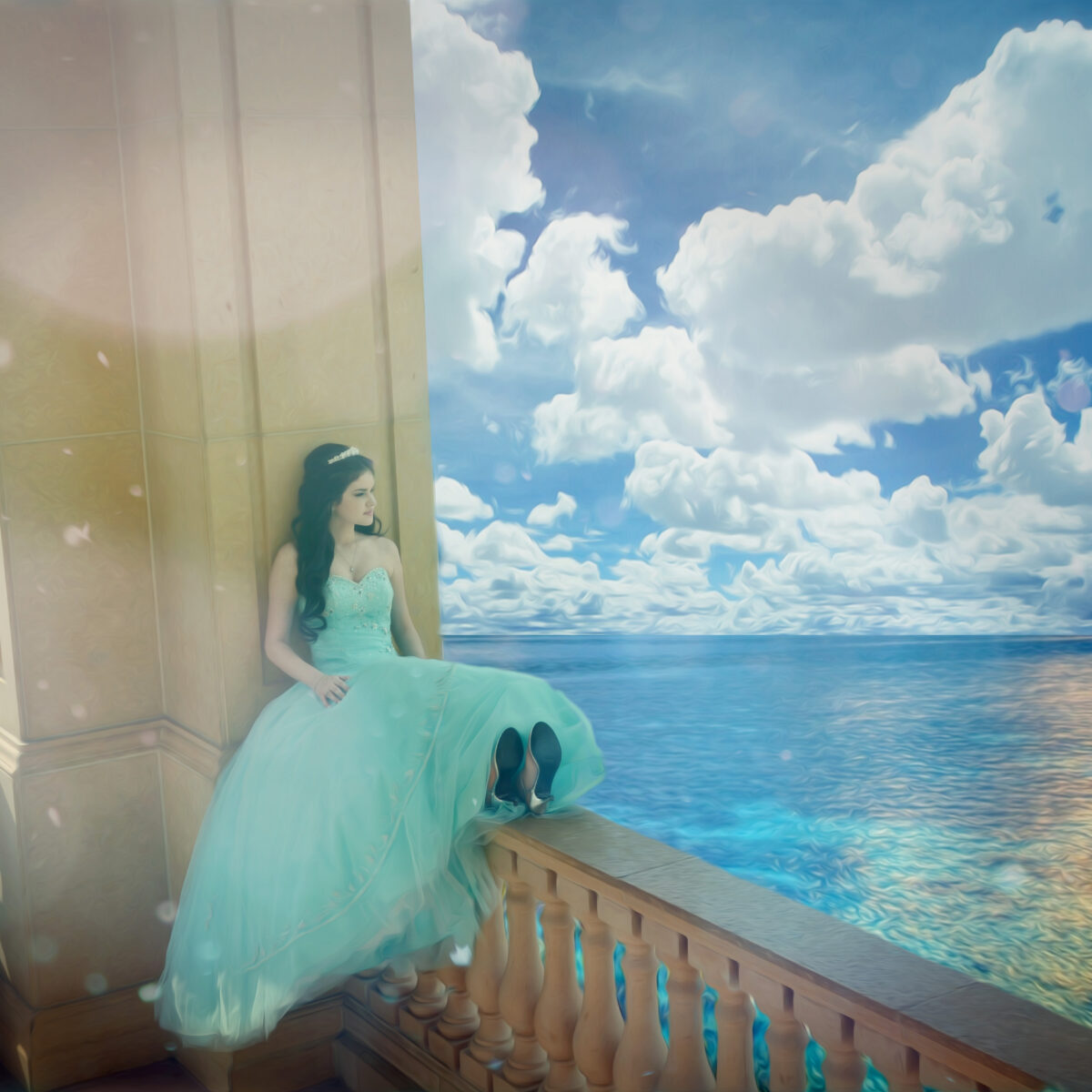 A girl in a blue dress gazes at the ocean under a cloudy sky.
